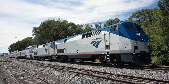 An Amtrak train travels through Lamy, New Mexico.