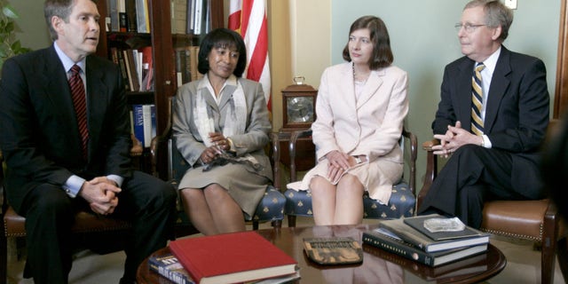 United States Senate Majority Leader Bill Frist (R-TN), (left) and Senate Majority Whip Mitch McConnell (R-KY), (R), appear with two of President George W. Bush's judicial nominees, California Supreme Court Justice Janice Rogers Brown, second from left, and Texas Supreme Court Justice Priscilla Owen, REUTERS/Chip Somodevilla