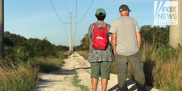 Chris and Roberta Laundrie in the  Myakkahatchee Creek Environmental Park on the day police discovered their son's remains. (Michael Ruiz/Fox News Digital)