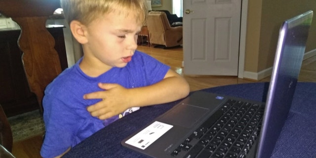 IWF President Carrie Lukas's son saying the Pledge of Allegiance during remote school. (Carrie Lukas)