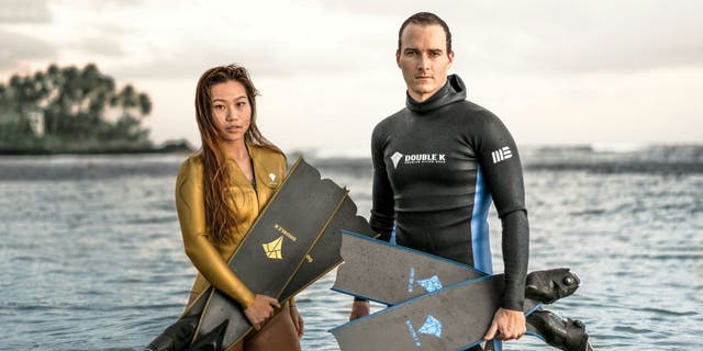 Free diver Yanna Xian (left) and photographer Mitch Brown (right) have swum with whales before in their home city of Honolulu.