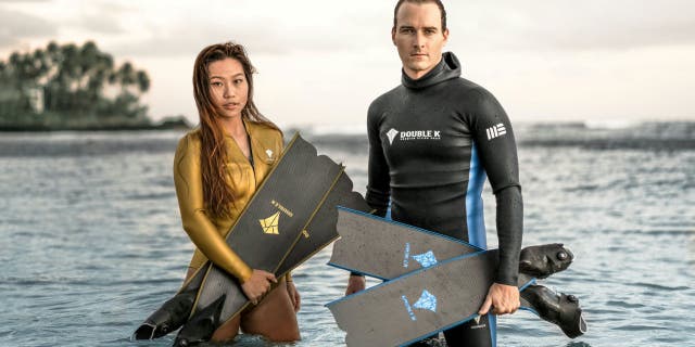 Free diver Yanna Xian (left) and photographer Mitch Brown (right) have swum with whales before in their home city of Honolulu.