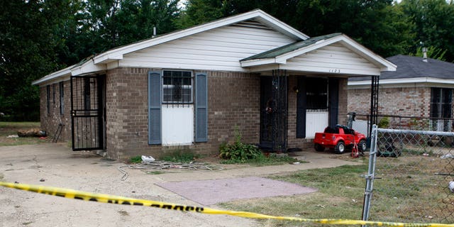 The outside of a Memphis home where a fire killed 10 people. Metal bars were placed over most windows of the house. (Associated Press)