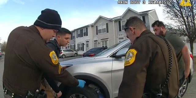 New Castle County police and a good Samaritan quickly decide how best to rescue the woman.