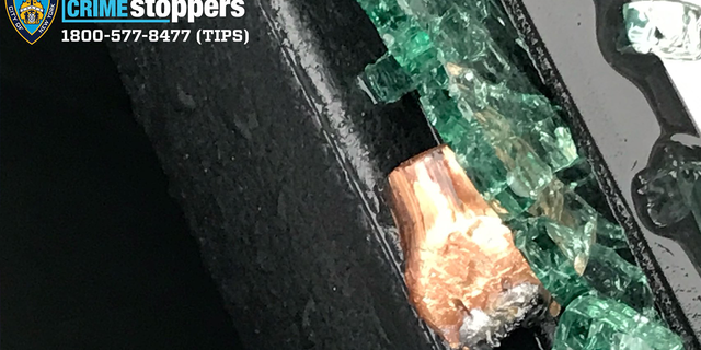 Bullet fired through one of the car’s windows, hitting the officer in the head