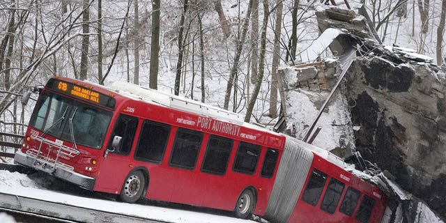 Rescuers rappelled nearly 150 feet to help stranded bus passengers.