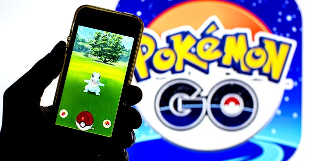 In this photo illustration a Pokémon GO app seen displayed on a smartphone with a Pokémon GO logo in the background. (Photo Illustration by Thiago Prudêncio/SOPA Images/LightRocket via Getty Images)