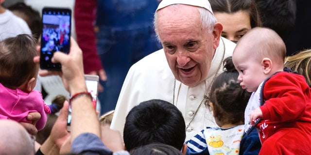 VATICAN - 12/19/2021: Pope Francis greets and blesses the children cared for by the Vatican's Santa Marta Pediatric Clinic in Paul VI Hall.  (Photo by Stefano Costantino/SOPA Images/LightRocket via Getty Images) 