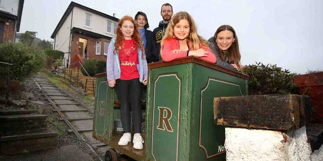 The Atkinson family in their funicular railway. It is believed to be one of the smallest funicular railways in the U.K.