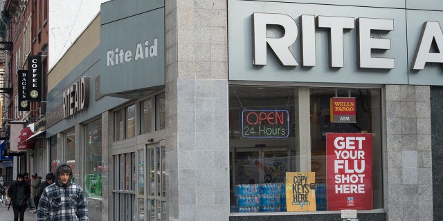 People walk past a Rite Aid store in Chelsea, New York on January 8, 2018. (BRYAN R. SMITH/AFP via Getty Images)