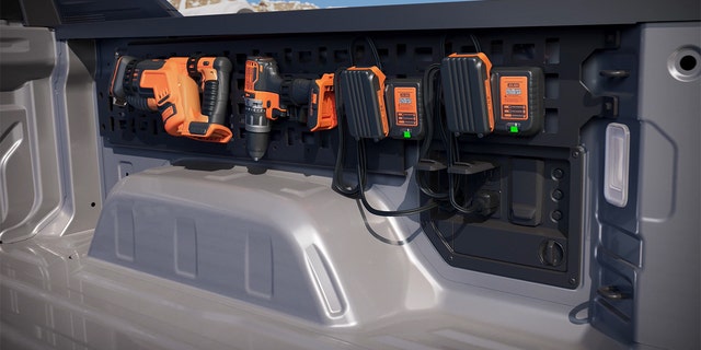 The Silverado EV PowerBase has a 10.2 kw output and can be paired with a rack for charging tools.