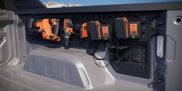 The Silverado EV PowerBase has a 10.2 kw output and can be paired with a rack for charging tools.