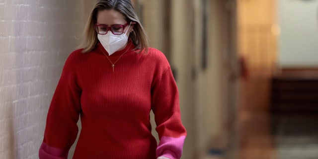  Sen. Kyrsten Sinema walks to her office in the basement of the U.S. Capitol Building on January 19, 2022 in Washington. (Photo by Anna Moneymaker/Getty Images)