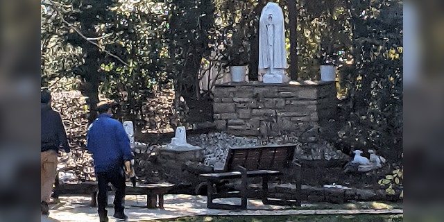 Staff removing the desecrated statues.