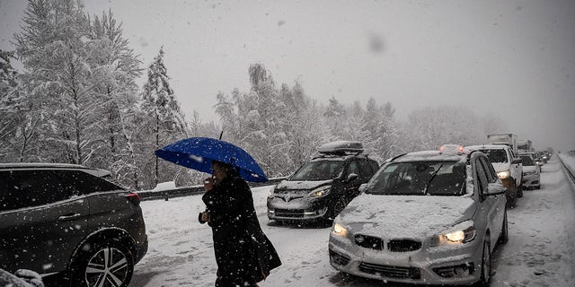 The Red Cross advises against getting out of your car when it's trapped in freezing temperatures.