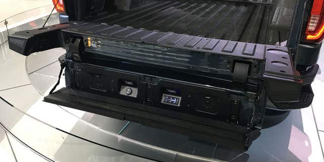 The GMC Multi-Pro tailgate can be set to six positions, including one that creates a step.