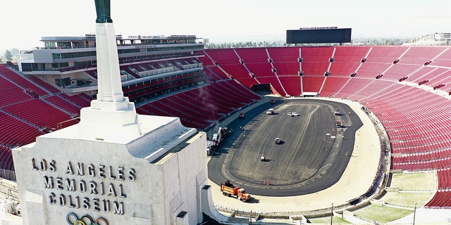Construction of a quarter-mile track inside the L.A. Memorial Coliseum is underway.
