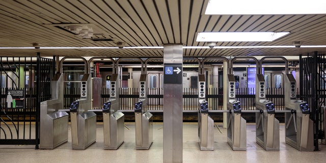 FILE: Turnstiles stand empty of commuters at the Bowling Green subway station in the morning in New York.  Photographer: Sarah Blesener/Bloomberg via Getty Images