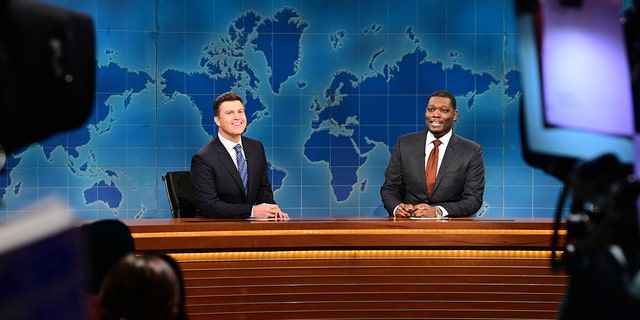 Anchor Colin Jost and anchor Michael Che during Weekend Update on Saturday, January 22, 2022 -- (Photo by: Will Heath/NBC/NBCU Photo Bank via Getty Images)