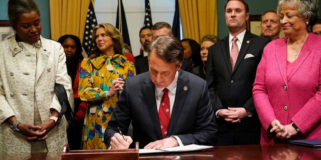 Virginia Gov. Glenn Youngkin signs executive orders in the governors conference room on  Jan. 15, 2022, in Richmond, Virginia.