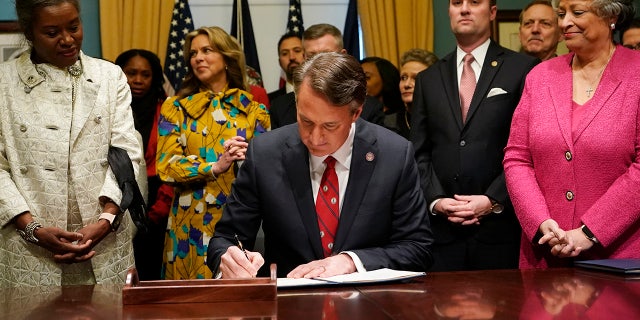 Virginia Gov. Glenn Youngkin signs executive orders in the governors conference room on  Jan. 15, 2022, in Richmond, Virginia.