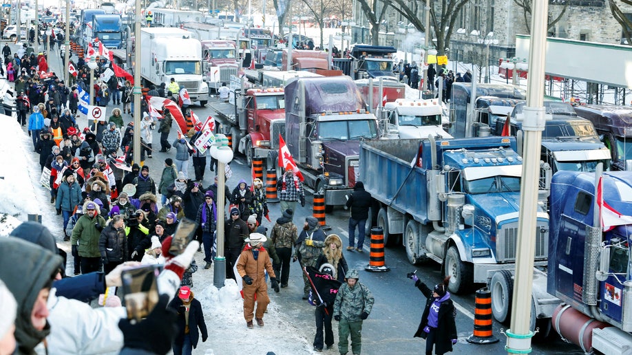 Trucks sit parked on Wellington Street near the Parliament Buildings as truckers and their supporters take part in a convoy to protest coronavirus disease (COVID-19) vaccine mandates 