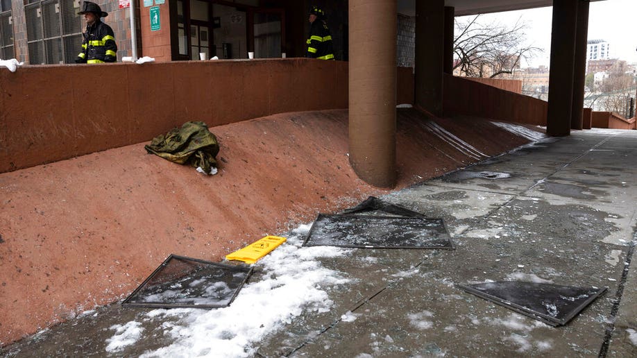 Debris lies on the ground after a fatal fire at an apartment building in the Bronx