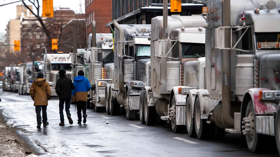 Trucks are parked on Metcalfe Street as a rally against COVID-19 restrictions, which began as a cross-country convoy protesting a federal vaccine mandate for truckers, continues in Ottawa, Ontario, on Jan. 30.