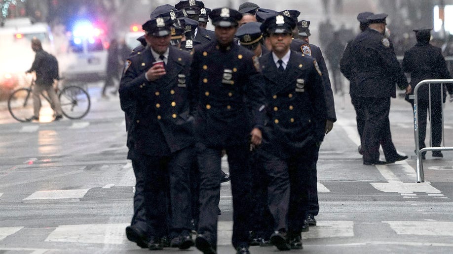 Members of New York Police Department arrive to attend a funeral service for NYPD officer Jason Rivera