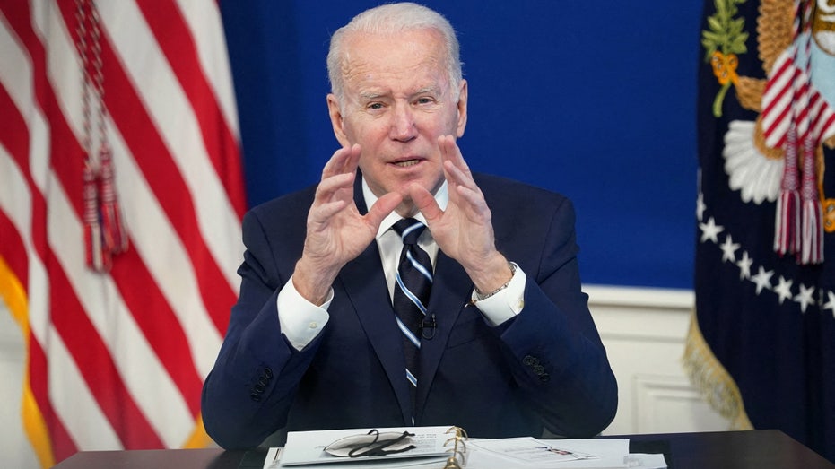 FILE PHOTO: U.S. President Joe Biden delivers remarks on the administration's coronavirus disease (COVID-19) surge response in the South Court Auditorium at the White House in Washington, U.S., January 13, 2022. REUTERS/Kevin Lamarque/File Photo