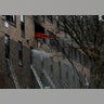 Emergency personnel from the FDNY respond to an apartment building fire in the Bronx