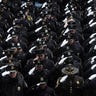 Law enforcement officers salute during the funeral service for NYPD officer Jason Rivera at St. Patrick's Cathedral in the Manhattan borough of New York City, on Jan. 28, 2022. (REUTERS/Jeenah Moon)