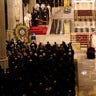 Cardinal Timothy Dolan blesses the casket of NYPD Officer Jason Rivera during Rivera's funeral service, Friday, Jan. 28, 2022, at St. Patrick's Cathedral in New York. (AP Photo/Mary Altaffer)