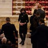 New York Gov. Kathy Hochul, left, walks back to her seat during a funeral service for NYPD officer Jason Rivera Friday, Jan. 28, 2022, at St. Patrick's Cathedral in New York. (AP Photo/Mary Altaffer, POOL)