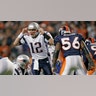 New England Patriots quarterback Tom Brady (12) calls an audible while being watched by Denver Broncos linebacker Al Wilson Saturday, January 14, 2006 at Invesco Field at Mile High in Denver, CO.