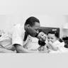 Civil rights leader Reverend Martin Luther King Jr. relaxes at home with his family in May 1956 in Montgomery, Alabama. 