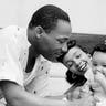 Civil rights leader Reverend Martin Luther King Jr. relaxes at home with his family in May 1956 in Montgomery, Alabama. 