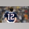 Quarterback Tom Brady /sports/photos-tom-brady-to-retire-from-nfl-after-legendary-22-seasons/12 of the New England Patriots looks on during a break in game action against the Carolina Panthers during Super Bowl XXXVIII at Reliant Stadium on February 1, 2004 in Houston, Texas.