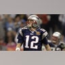 Quarterback Tom Brady /sports/photos-tom-brady-to-retire-from-nfl-after-legendary-22-seasons/12 of the New England Patriots walks on the field during Super Bowl XXXVIII against the Carolina Panthers at Reliant Stadium on February 1, 2004 in Houston, Texas.