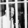 Dr. Martin Luther King peers between the bars of his jail cell at the St. John's County Jail on June 11, 1962, in St. Augustine, Florida, shortly after he and other integration demonstrators were arrested on trespass charges at a local motel.