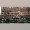 Firefighters work outside an apartment building after a fire in the Bronx