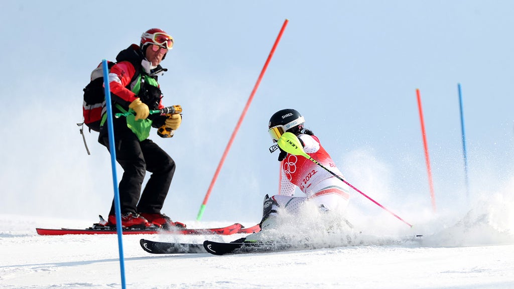 Skier loses cool after run interrupted by course worker in middle of path