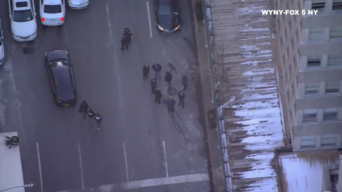 One of the detectives fired a shot as the vehicle was driving away, according to the New York Post.