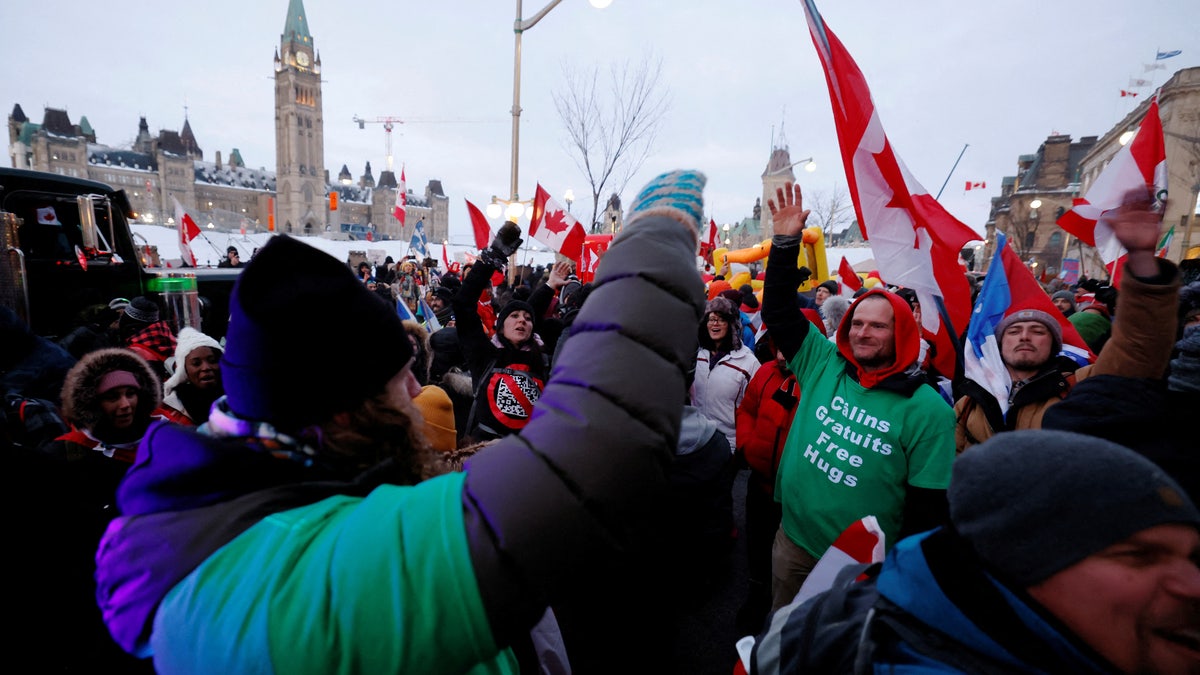 Demonstrators dance in the streets as truckers and supporters continue to protest in Ottawa, Ontario, Canada. REUTERS