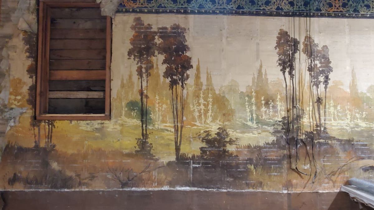 The two landscape murals on the building’s north- and south-facing walls measure about 20 feet in height and 60 feet in length.