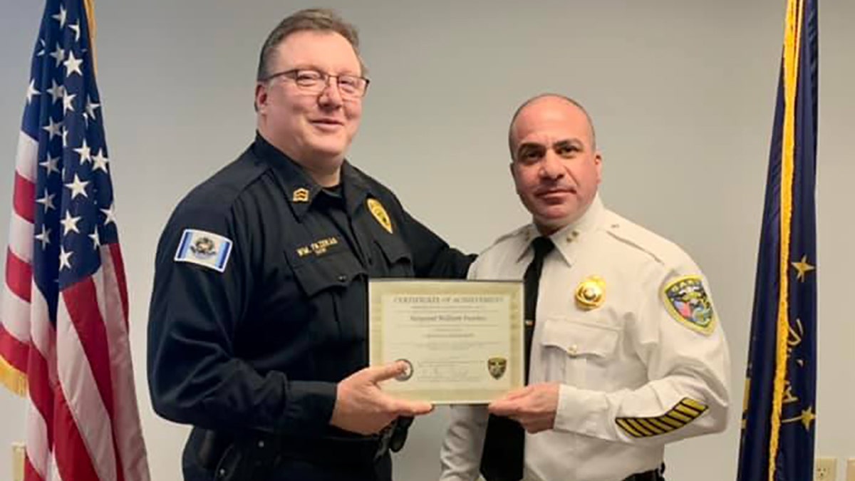 Sgt William Fazekas, in the dark shirt, and Commander Jack Hamady of the Gary Police Department on Jan. 13, 2022.