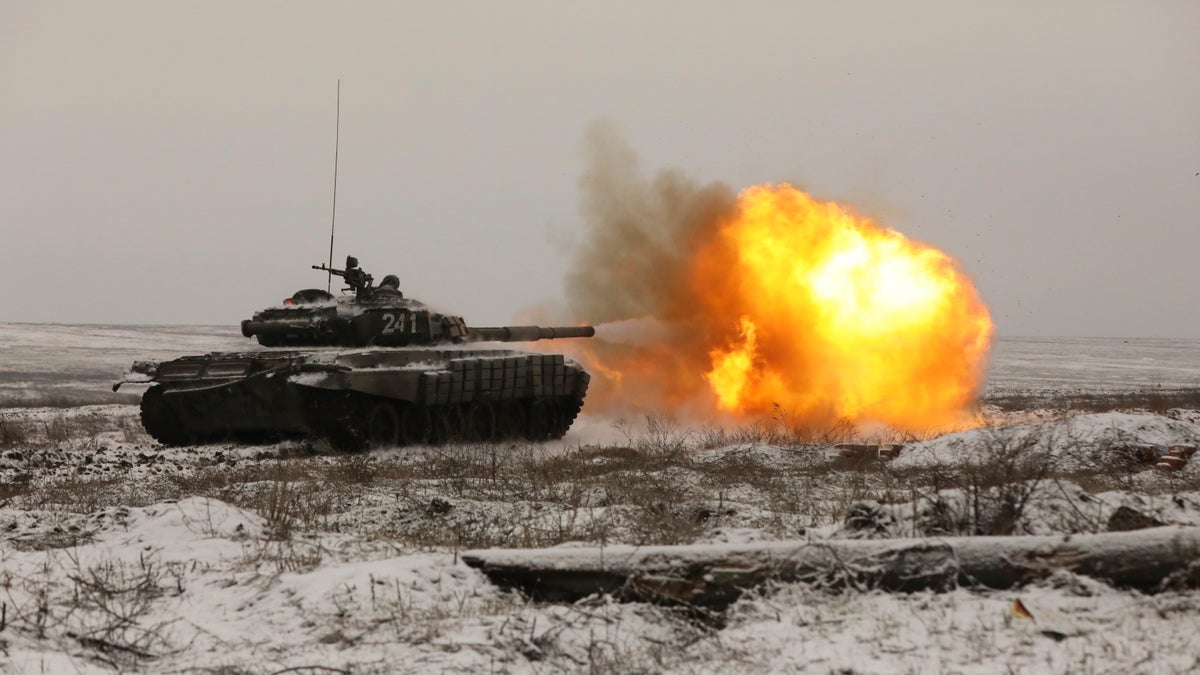 A Russian T-72B3 tank fires as troops take part in drills at the Kadamovskiy firing range in the Rostov region in southern Russia, Wednesday, Jan. 12, 2022. 