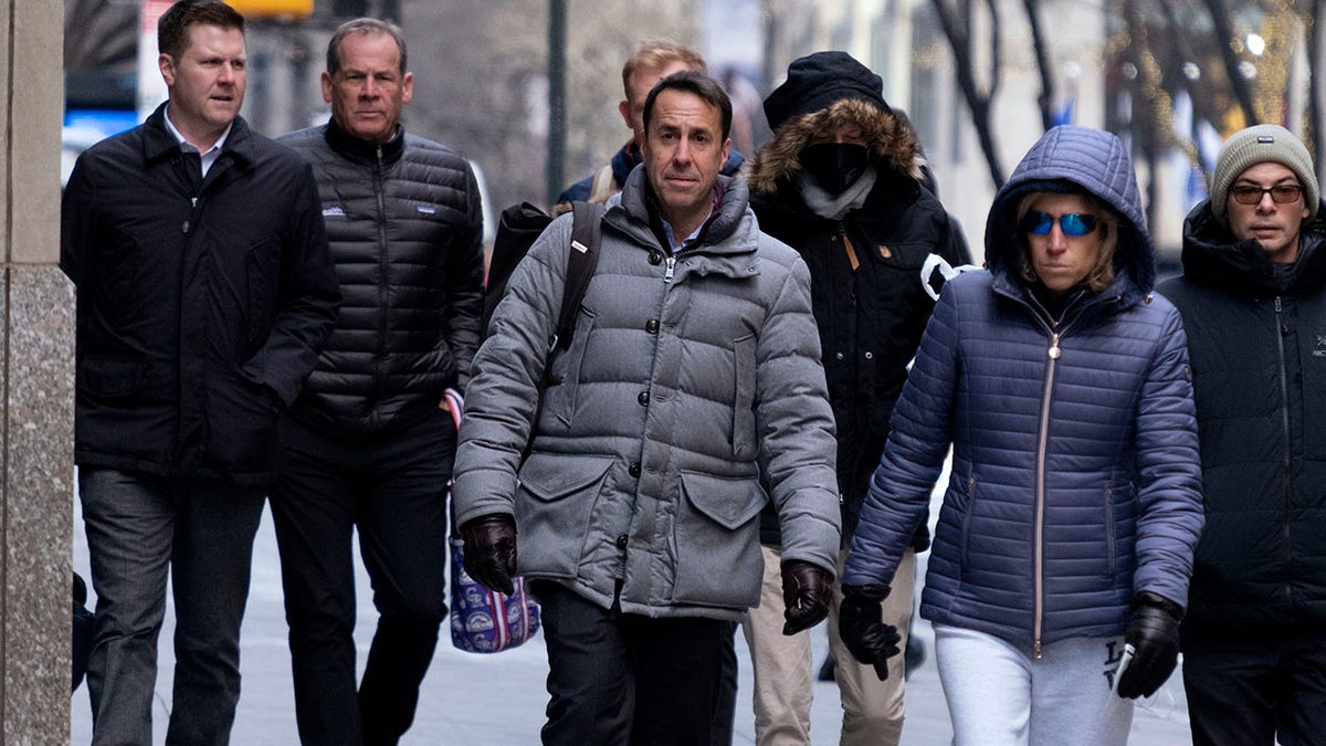 Major League Baseball deputy commissioner Dan Halem, center, arrives for a meeting in New York, Monday, Jan. 24, 2022, for the first in-person baseball negotiating session since the MLB lockout began. At far left is Patrick Houlihan, Senior Vice President &amp;amp; Deputy General Counsel, Labor Relations at Major League Baseball, and second from left is Colorado Rockies owner Dick Montfort.