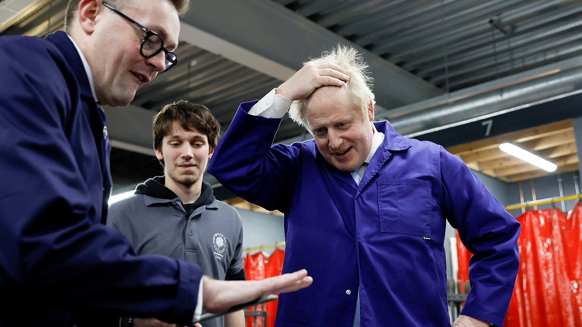 British Prime Minister Boris Johnson visits the technology center at Hopwood Hall College, in Middleton, Greater Manchester, England, Thursday Feb. 3, 2022. (Associated Press)