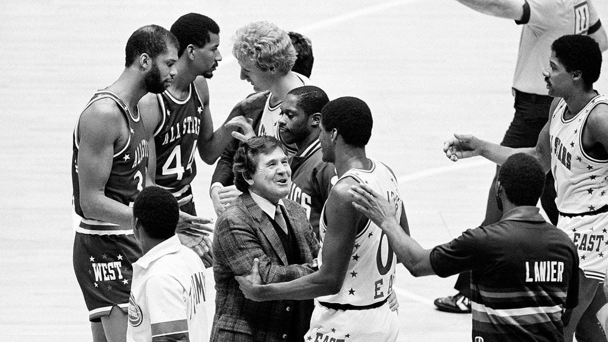 FILE - Eastern Conference coach Bill Fitch of the Boston Celtics congratulates Robert Parish also of the Celtics, after he grabbed the game-ending rebound to nail down the team's 120-118 win over the Western Conference in the NBA All-Star game at the Meadowlands Arena in East Rutherford, N.J., Sunday, Feb. 1, 1982. Bill Fitch, who guided the Boston Celtics to one of their championships during a Hall of Fame coaching career spanning three decades, has died. He was 89. A two-time NBA coach of the year, Fitch died Wednesday, Feb. 2, 2022, in Lake Conroe, Texas.